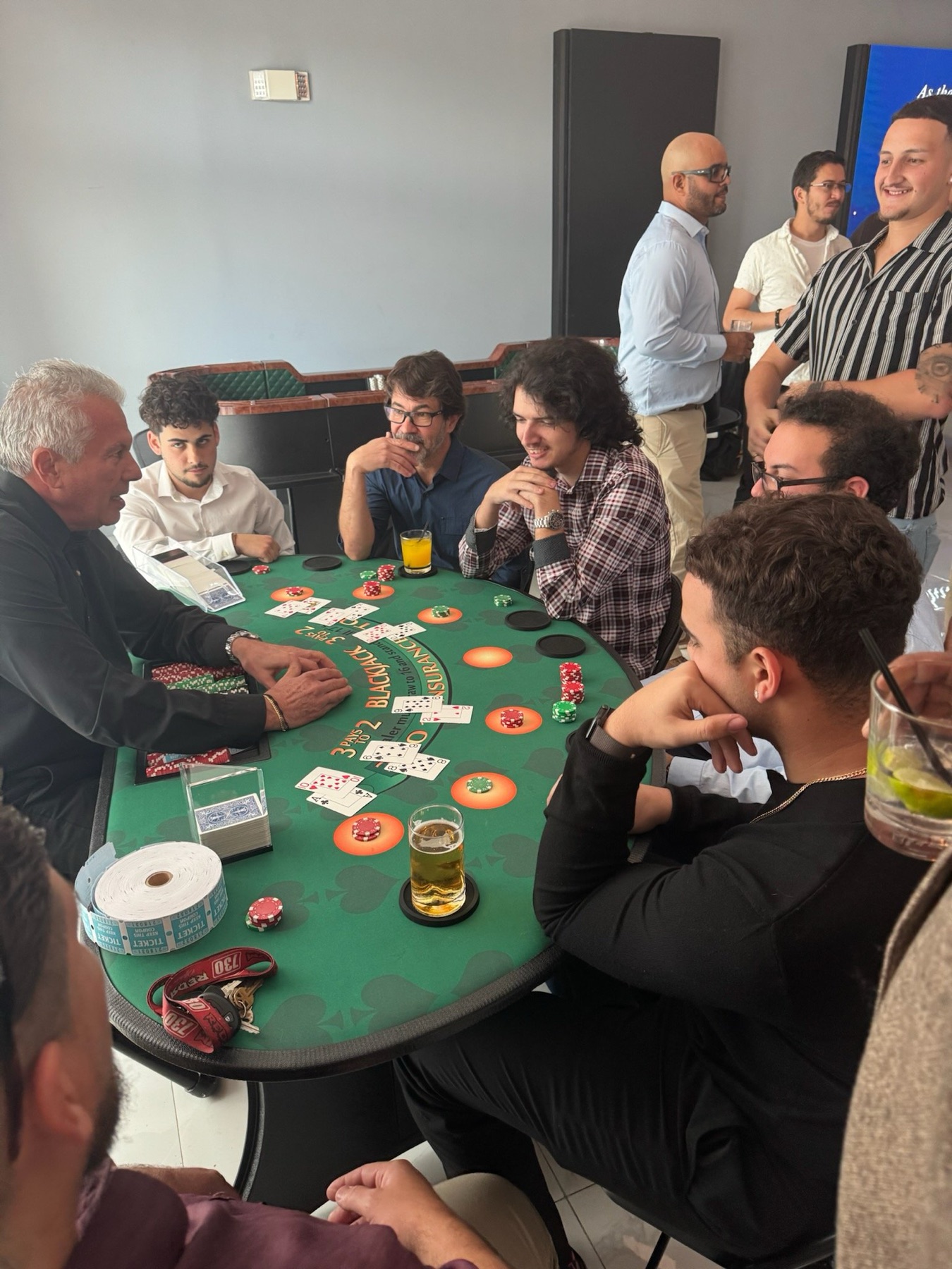 Friends crowding a blackjack table at a New Year's Eve party in Doral