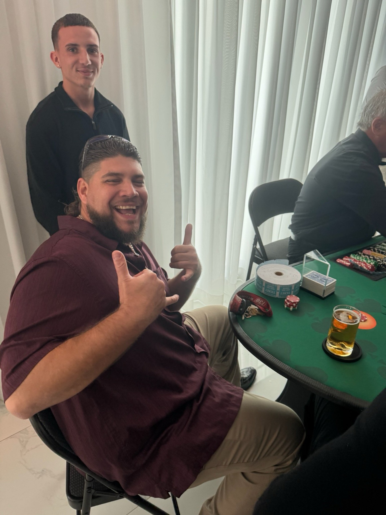 Guest celebrating a winning hand at a New Year's Eve party